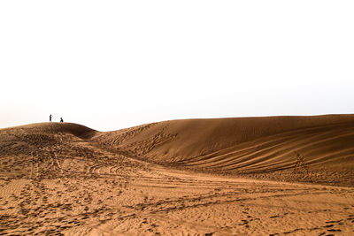 Scenic view of desert against clear sky