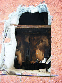 Close-up of damaged brick wall