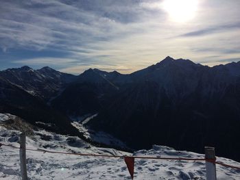 Scenic view of snowcapped mountains against sky