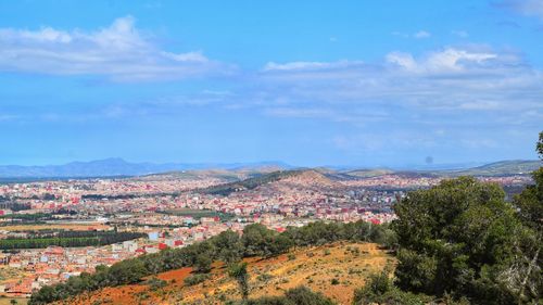 Aerial view of townscape against sky