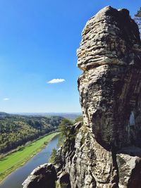 Rock formations on landscape against sky