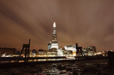 City skyline against cloudy sky