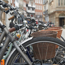 Close-up of bicycle parked on street against buildings