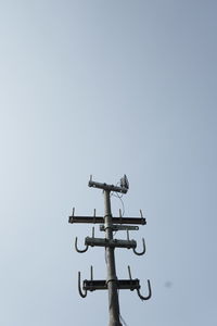 Low angle view of weather vane