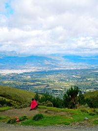 Scenic view of landscape against cloudy sky