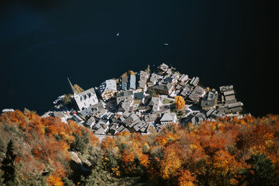 View of town against clear sky at night