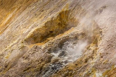 View of steam emitting through rocks