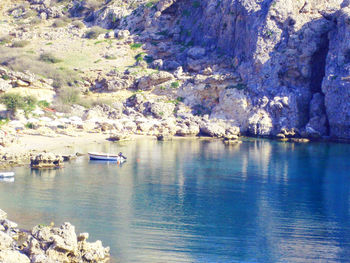 Scenic view of river with mountains in background