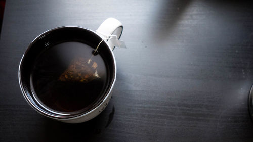 High angle view of coffee cup on table