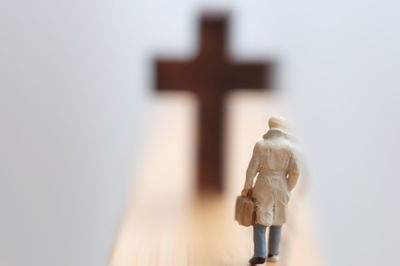 Close-up of figurine on wood