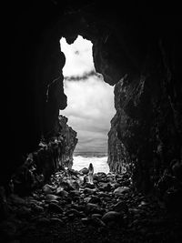 Scenic view of sea seen through cave