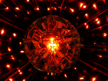 Low angle view of illuminated lights at night