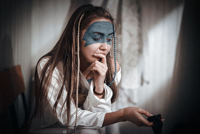 Portrait of woman using mobile phone