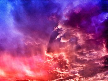 Low angle view of dramatic sky during sunset