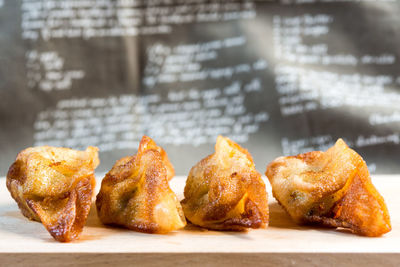 Close-up of fried chicken dumplings on table