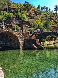 Bridge over river by building