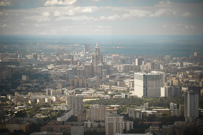High angle view of modern buildings in city against sky