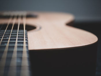 Close-up of guitar on table