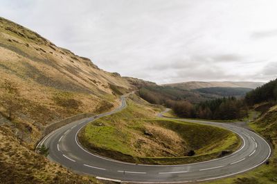 Scenic view of mountain road against sky