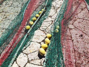 High angle view of fishing nets on street during sunny day