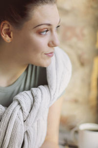 Close-up of young woman looking away