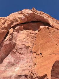 Low angle view of rock formation against clear sky