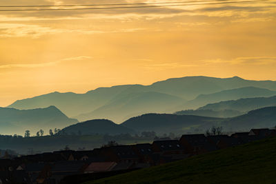 Colourful skies over penrith and the hazy lake district fells on an autumn afternoon