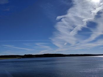 Scenic view of sea against blue sky