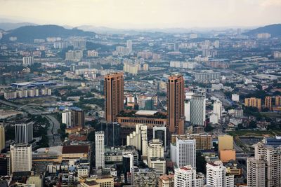 High angle view of buildings in city against sky