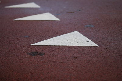 Close-up of triangle shape patterns on road