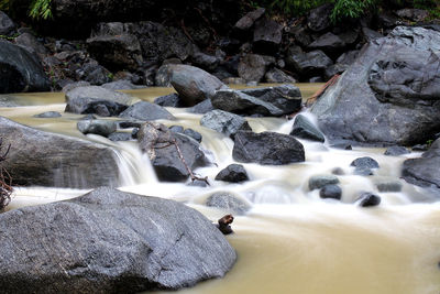 Stream flowing through rocks