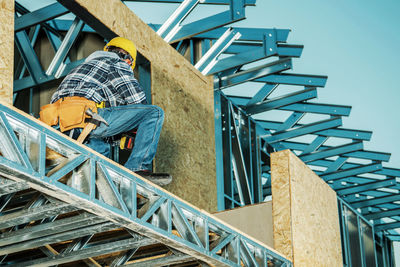 Low angle view of man standing on staircase