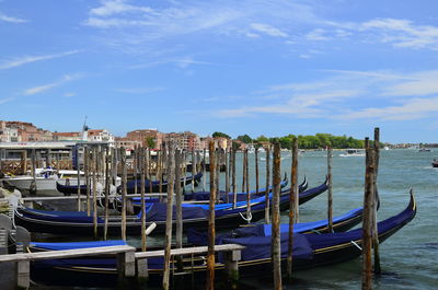 Boats moored in canal