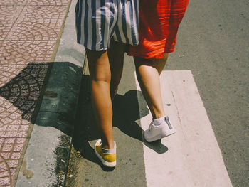 Low section of woman standing on floor