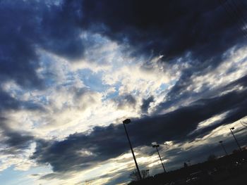 Low angle view of silhouette smoke against sky