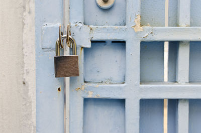 Close-up of pad lock with door 