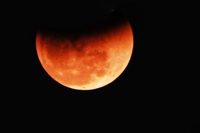 Low angle view of full moon at night