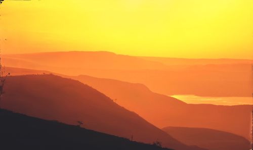 Scenic view of mountains at sunset