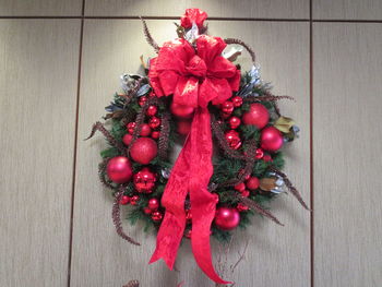 Close-up of christmas wreath on wall