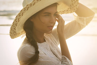 Young woman wearing hat