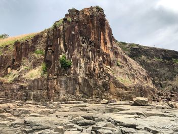 Rock formations on mountain against sky