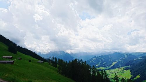 Scenic view of landscape against cloudy sky