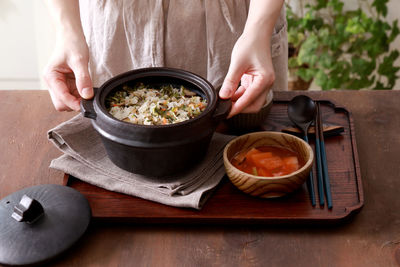 Midsection of man preparing food on table