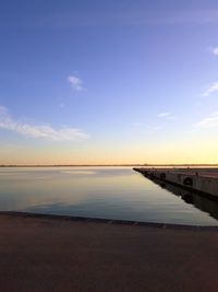 Scenic view of sea against sky at sunset