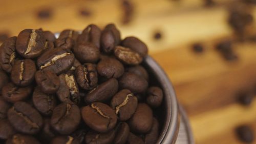 Close-up of coffee beans on table