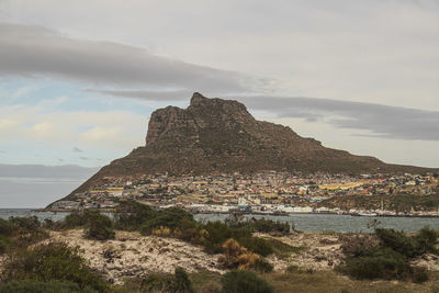 The view of the sentinel during early morning from hout bay beach near cape town, south africa.