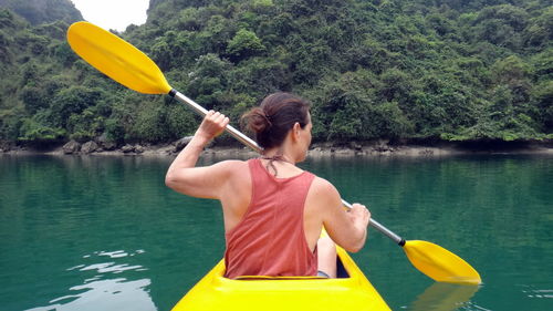 Rear view of man in kayak