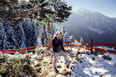 Man standing on snow covered mountain