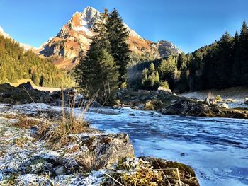 Scenic view of mountains against sky during winter