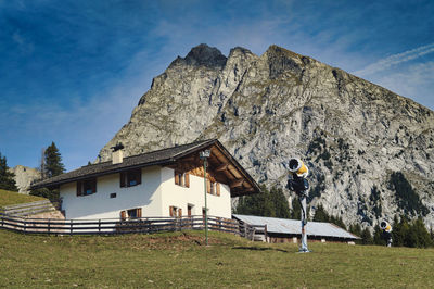 House on field against sky